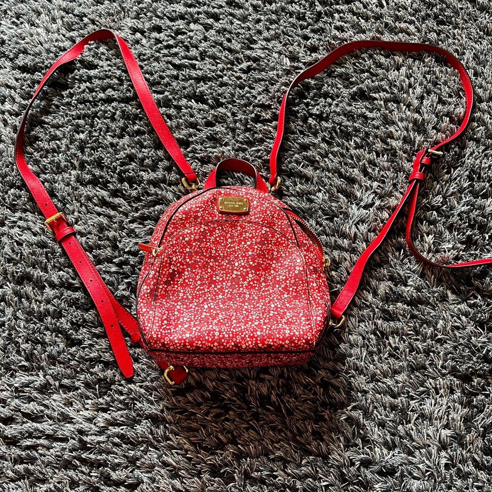 Small Michael Kors floral backpack.